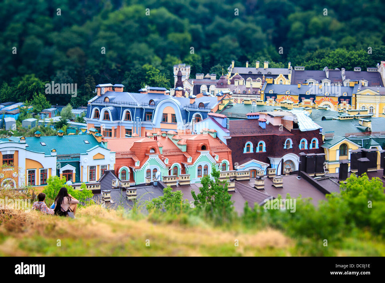 Two kids observing Kiev roofs sitting on the hill, Kyiv, Ukraine Stock Photo