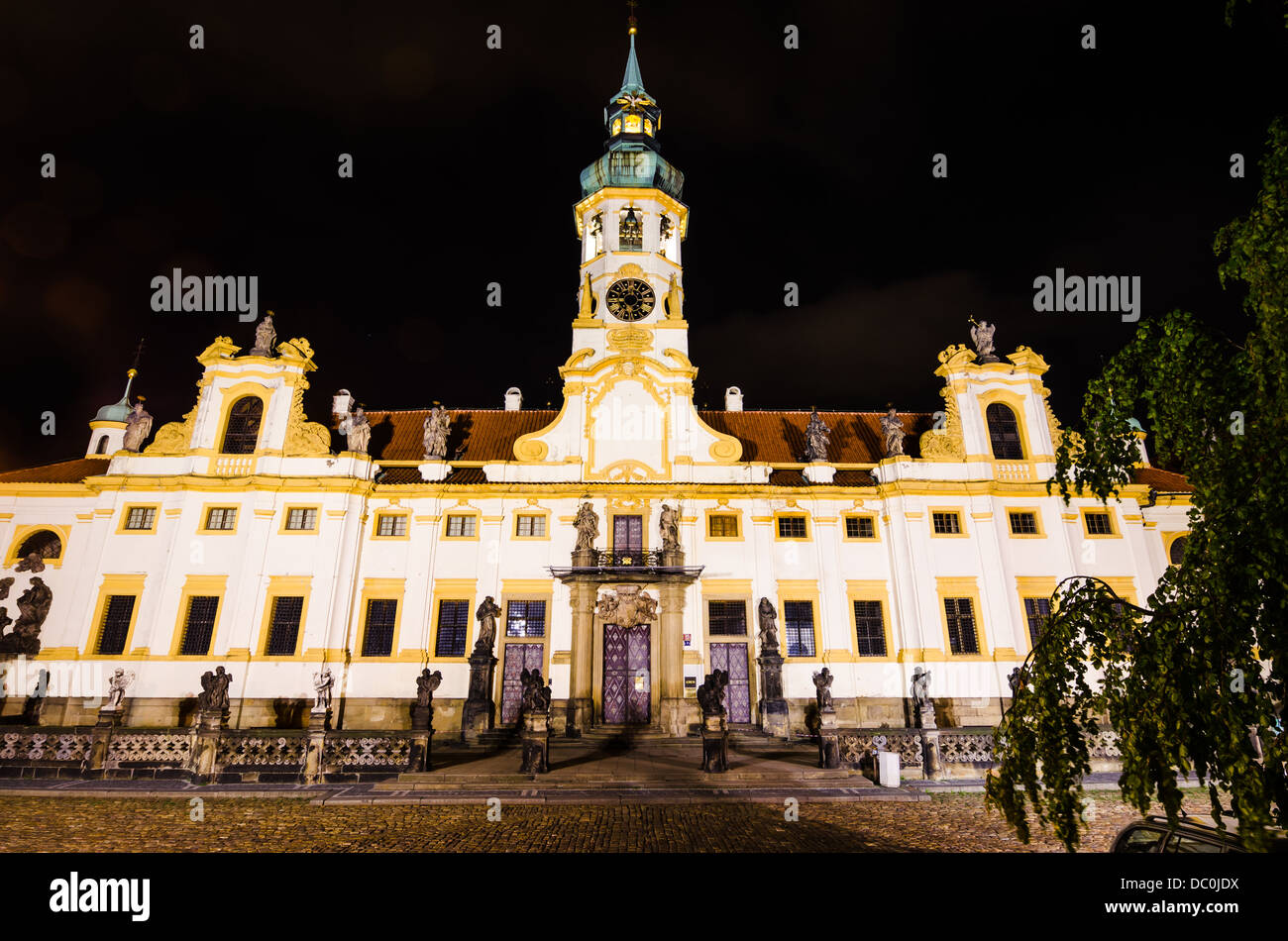 Loreta Sanctuary in Prague, with the Saints statues on the main entrance and with baroque bell tower Stock Photo
