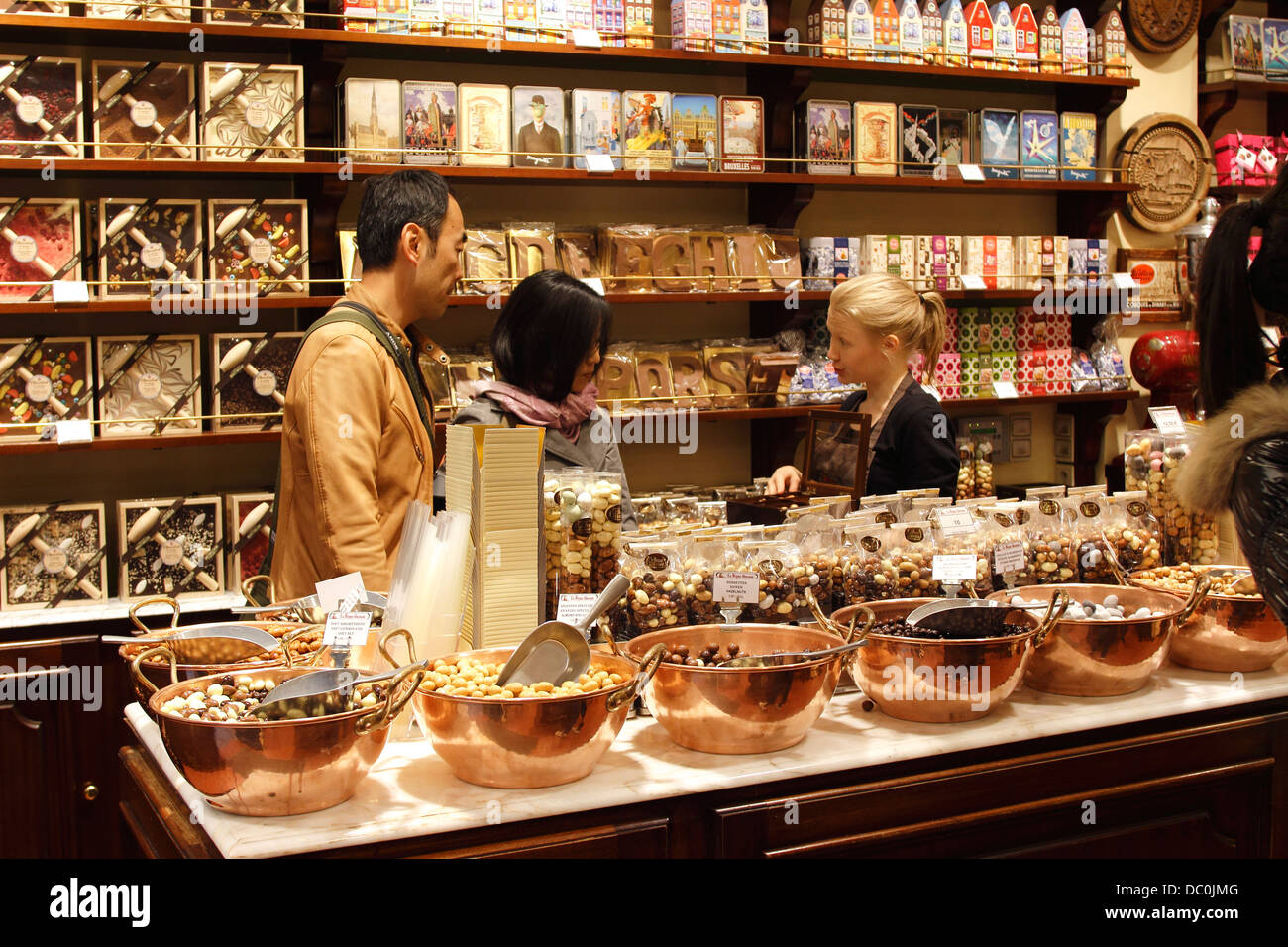 Brussels Belgium Europe Grand Platz Belgian chocolate shop with customers Stock Photo