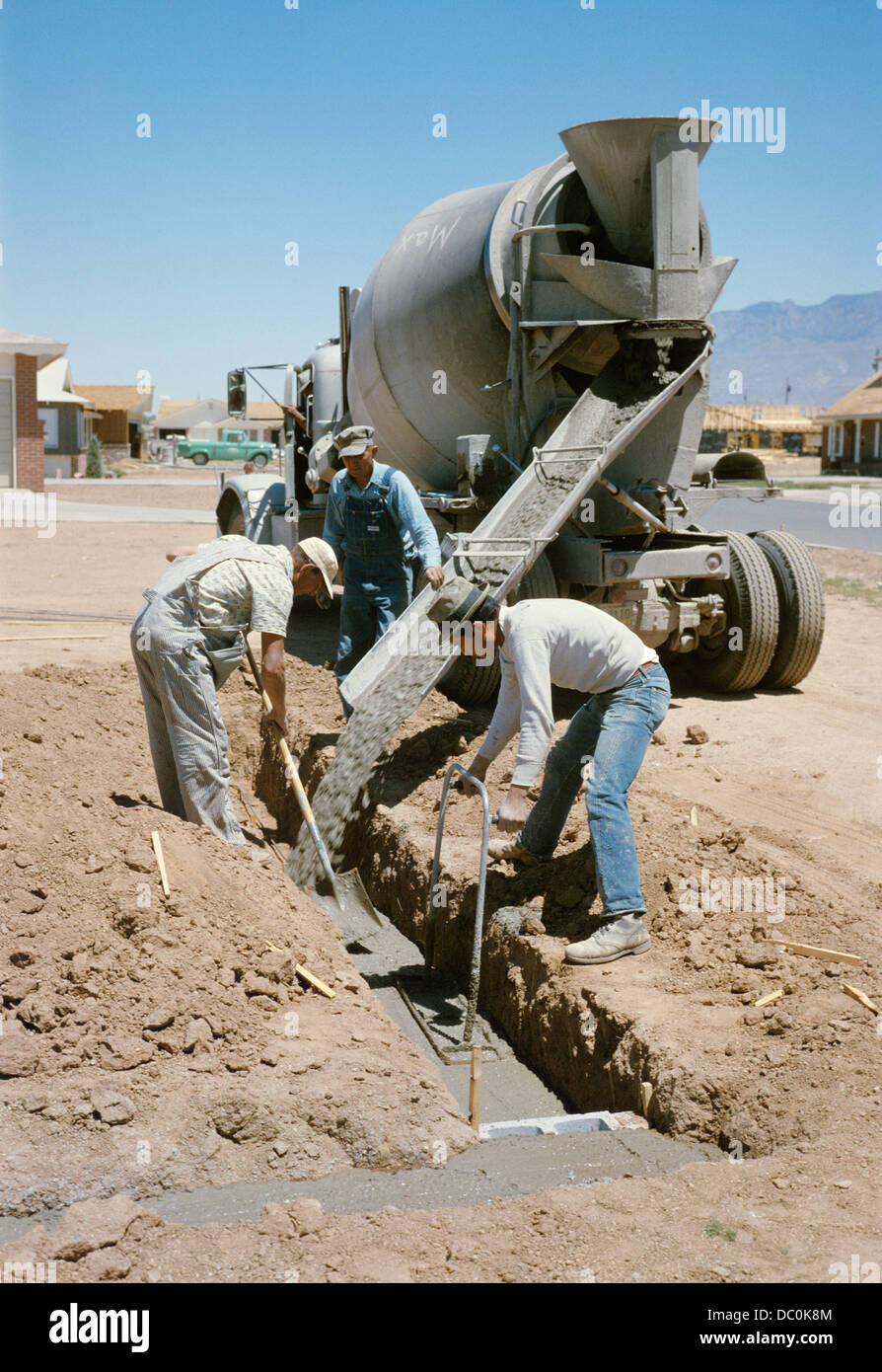 1960s 3 Workers Pouring Concrete For Foundation Of House In Albuquerque