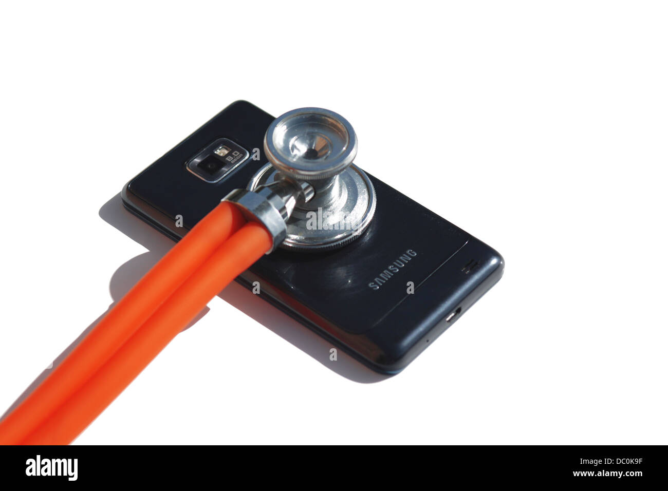 Stethoscope on the Samsung Galaxy S isolated on White Stock Photo