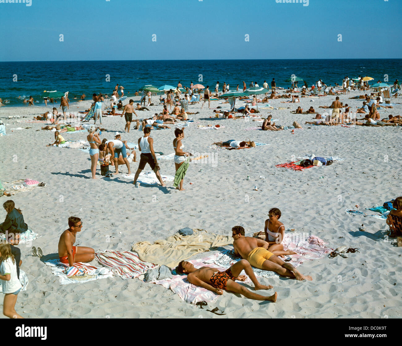 1960s PEOPLE ON BEACH SEASIDE HEIGHTS NEW JERSEY USA Stock Photo