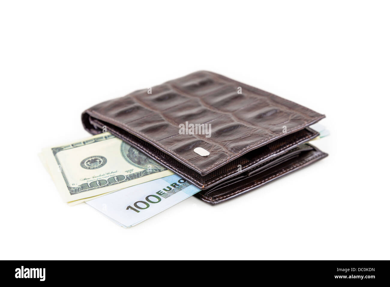 The brown leather wallet with euro and dollars is photographed on the close-up Stock Photo
