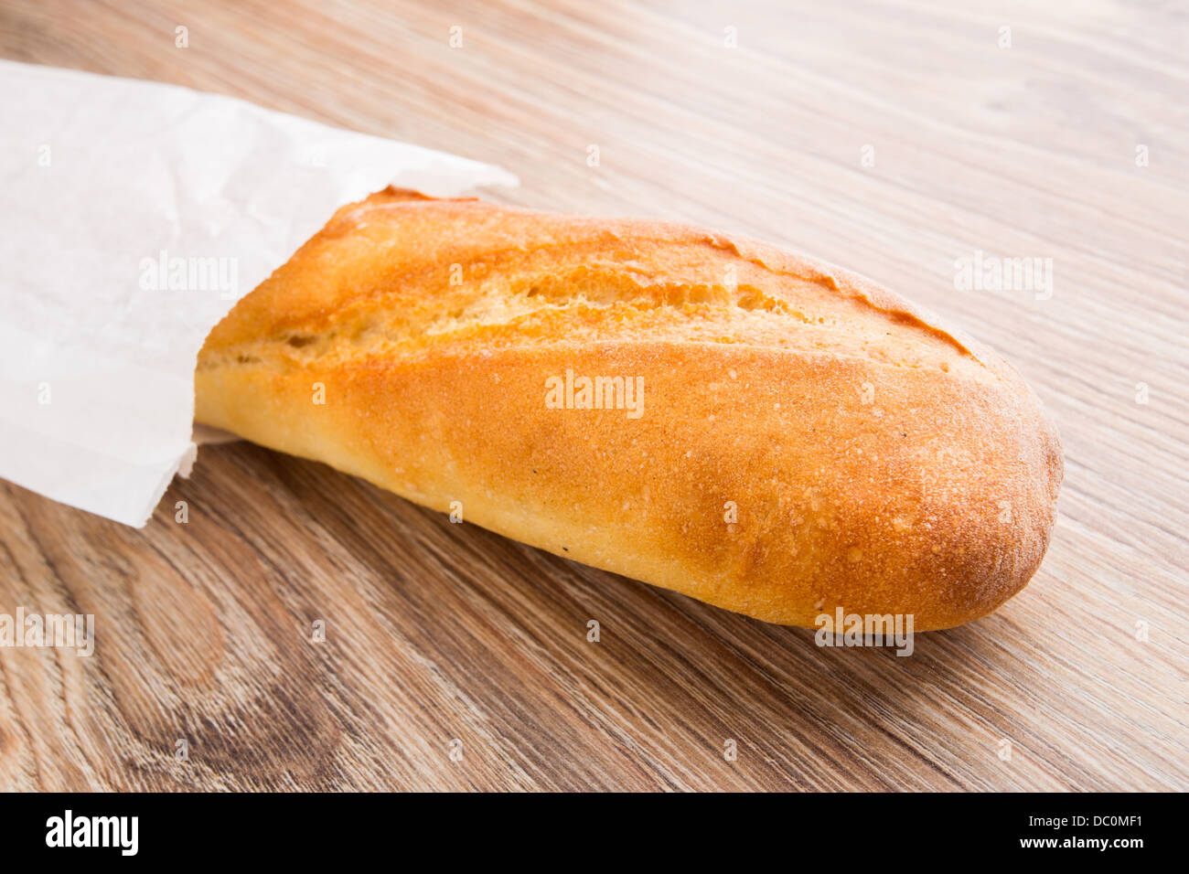 Baguette in paper bag Stock Photo - Alamy