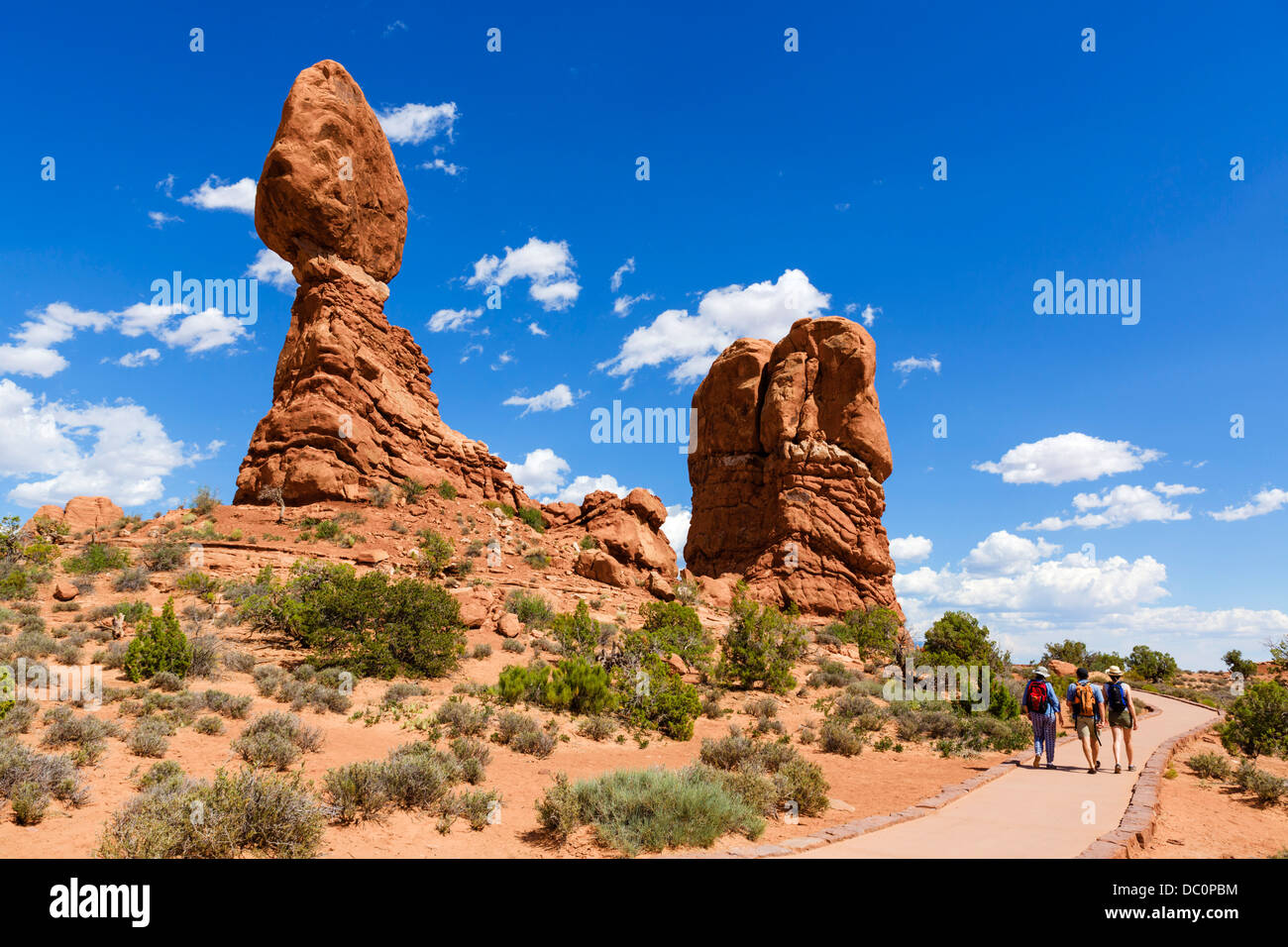 Walkers on the Balanced Rock Trail, Arches National Park, Utah, USA Stock Photo