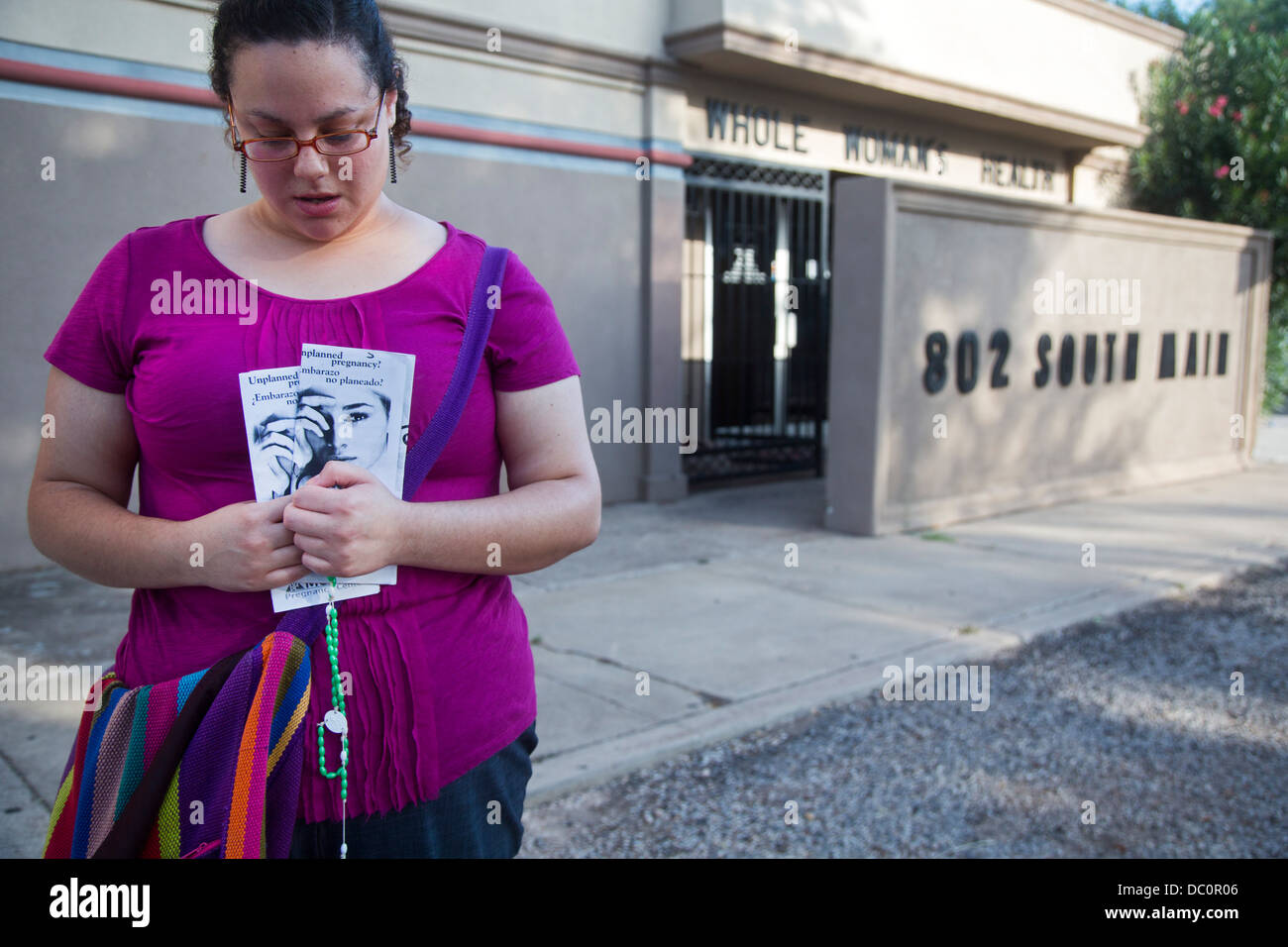 McAllen, Texas - Anti-abortion activist Erika Salazar prays outside Whole Women's Health, an abortion clinic. Stock Photo