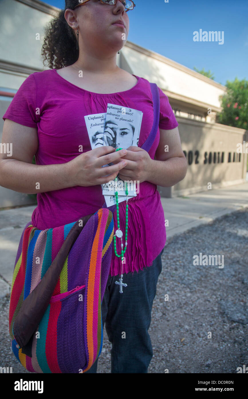 McAllen, Texas - Anti-abortion activist Erika Salazar prays outside Whole Women's Health, an abortion clinic. Stock Photo