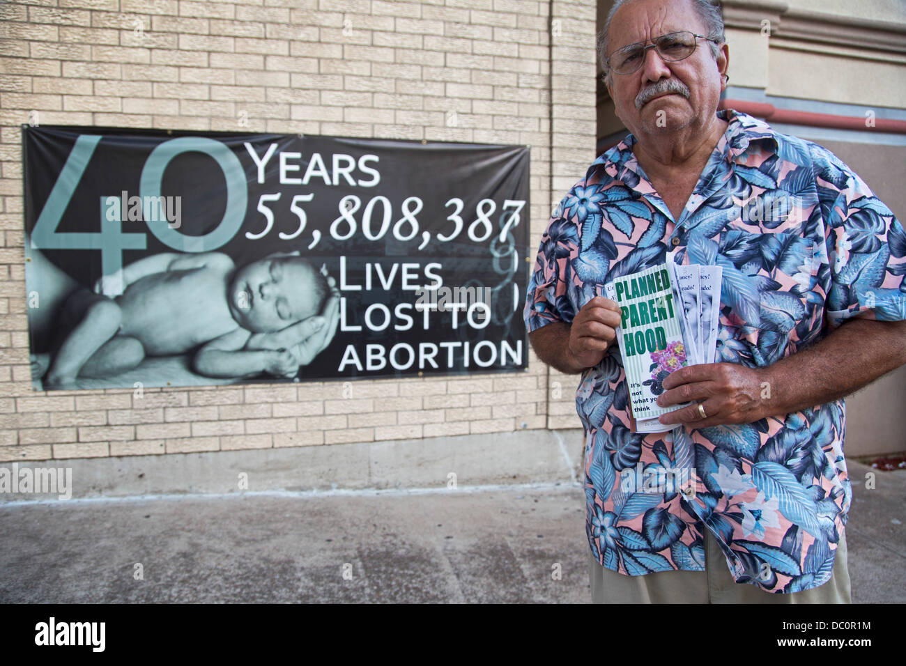 McAllen, Texas - Anti-abortion activist Rene Lizcano holds anti-abortion flyers outside Whole Women's Health, an abortion clinic Stock Photo