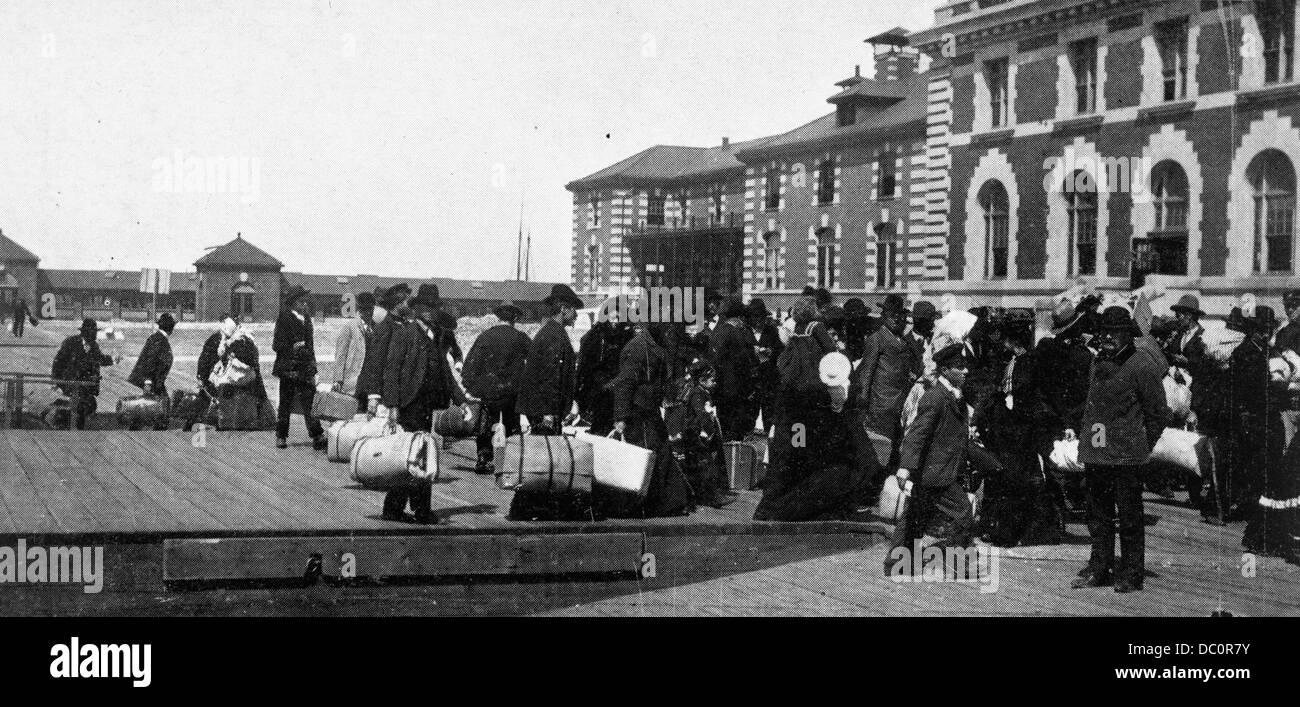 1900s 1910s 1920s ANONYMOUS IMMIGRANTS TO AMERICA LANDING ON ELLIS ISLAND NEW YORK USA Stock Photo