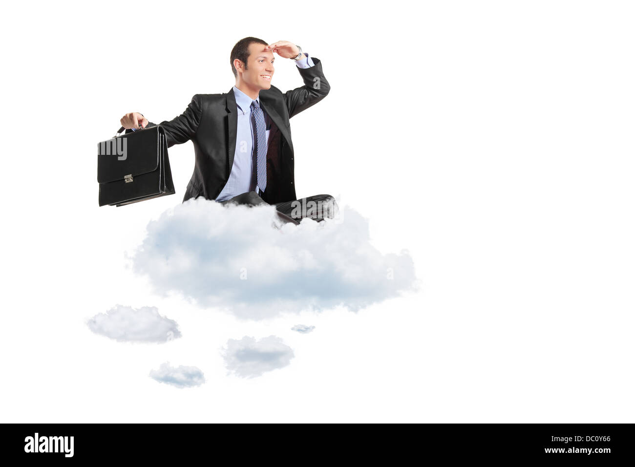 Young businessman with suitcase sitting on a cloud Stock Photo - Alamy
