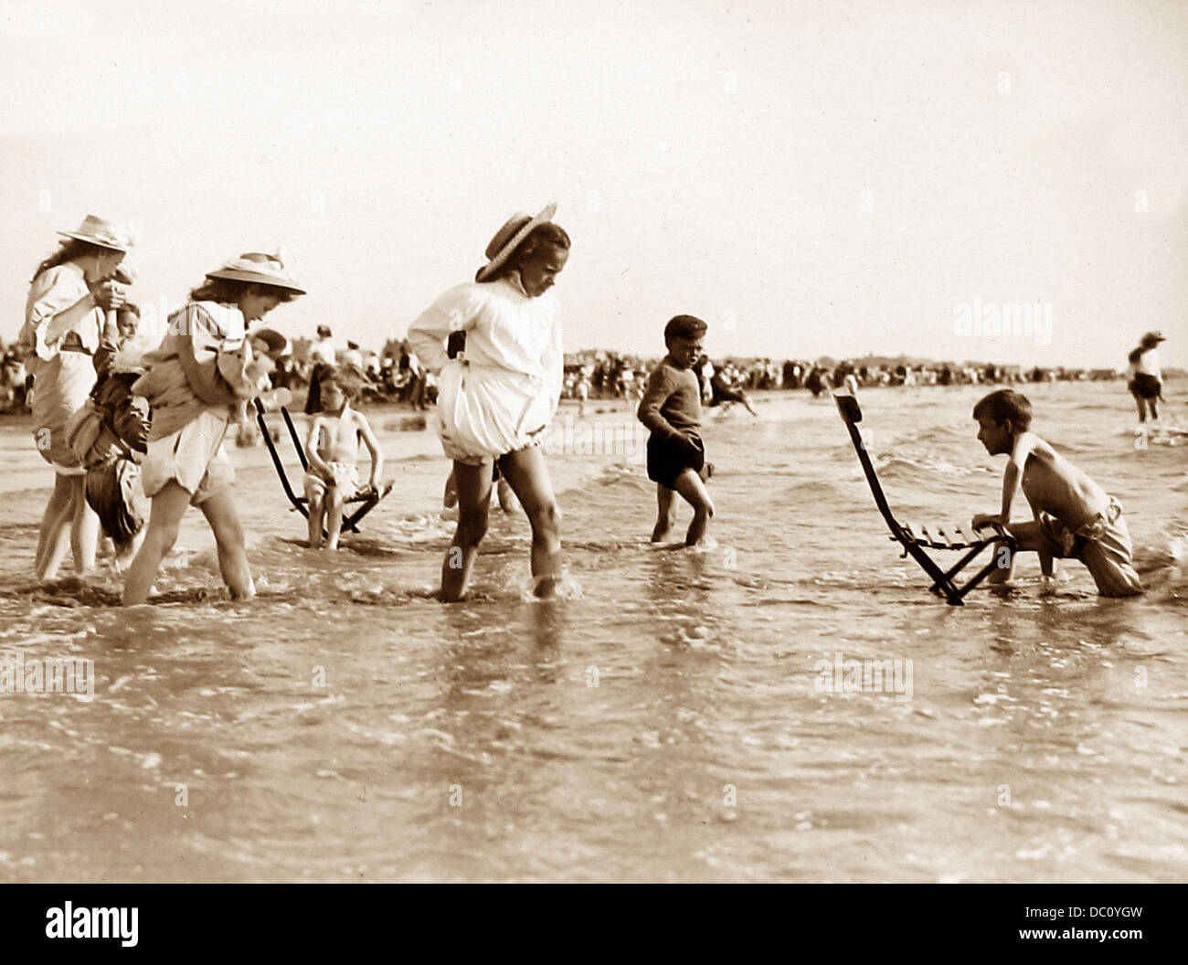 Children playing at the seaside Victorian period Stock Photo Alamy