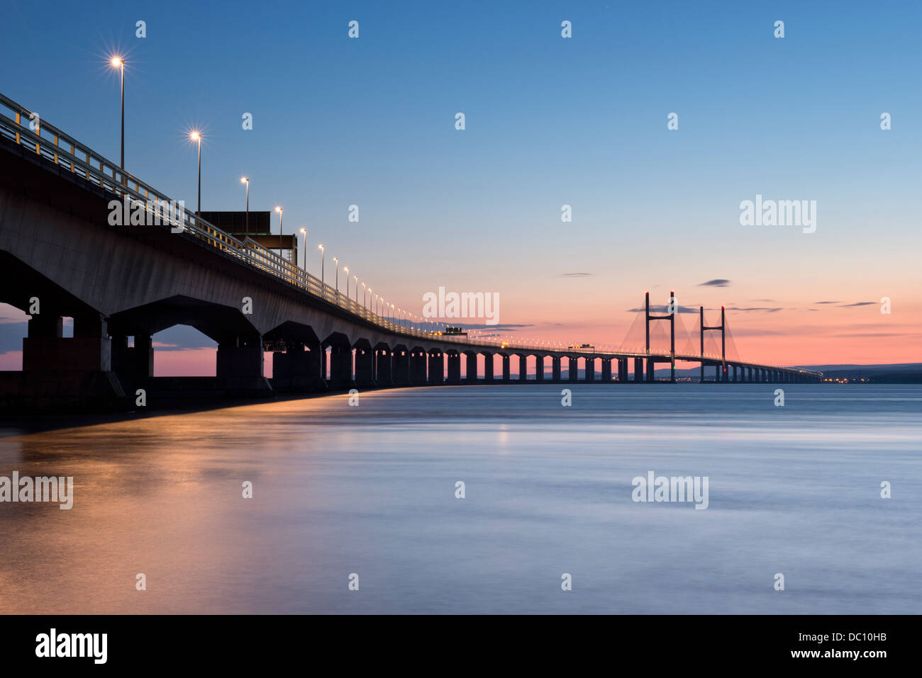 The Second Severn Crossing, carrying the M4 motorway, linking England and Wales, illuminated at dusk. Stock Photo