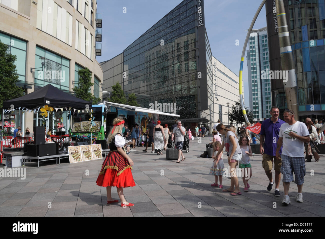 Shoppers walking on the Hayes in Cardiff city centre, Wales UK, woman in costume, street scene traffic free pedestrian street Stock Photo