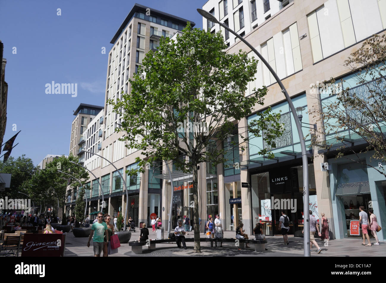 Shoppers walking on the Hayes in Cardiff city centre Wales UK. St Davids 2 building. pedestrian street scene traffic free Stock Photo