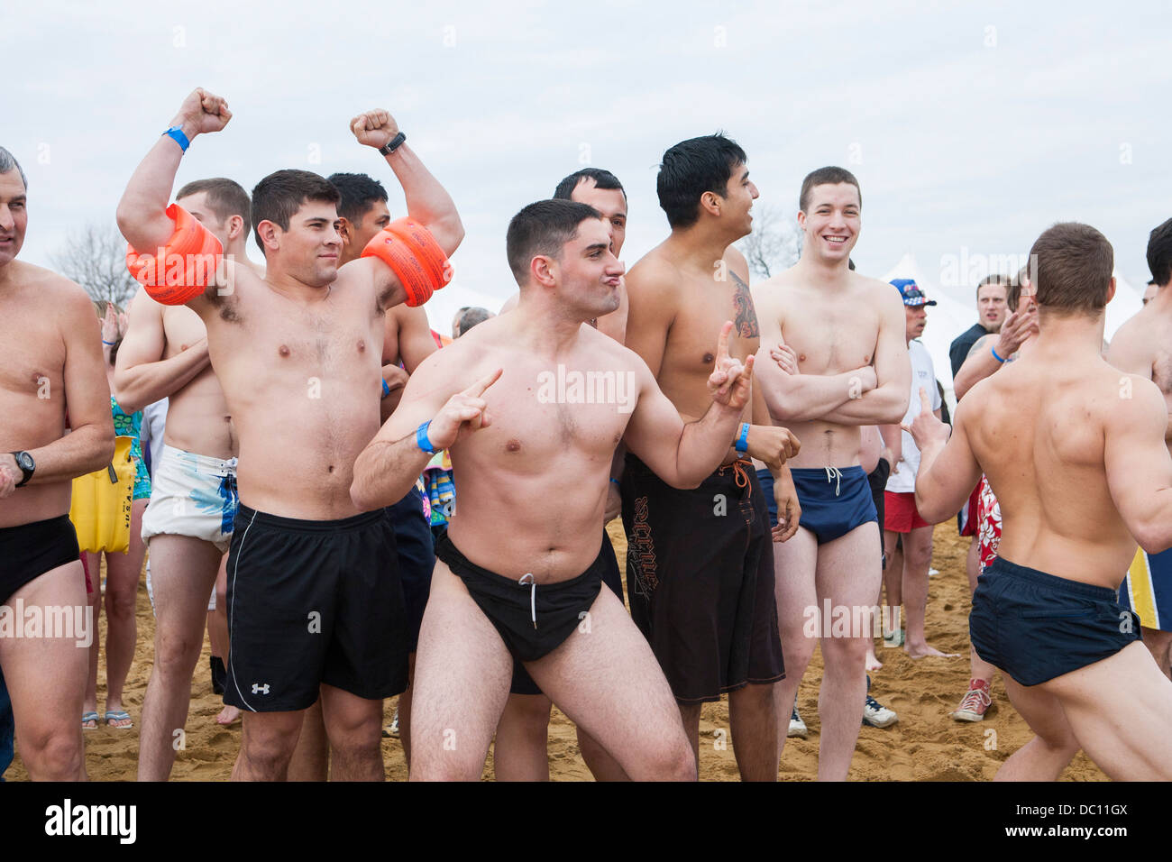 A polar bear plunge event where participants jump into ice cold water during the winter.  Stock Photo