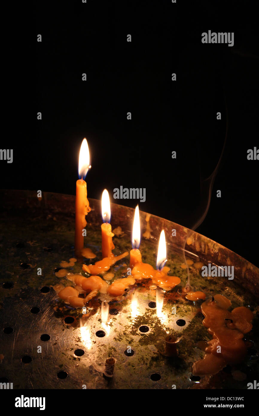 image of bright burning church candles on candlesticks Stock Photo Alamy