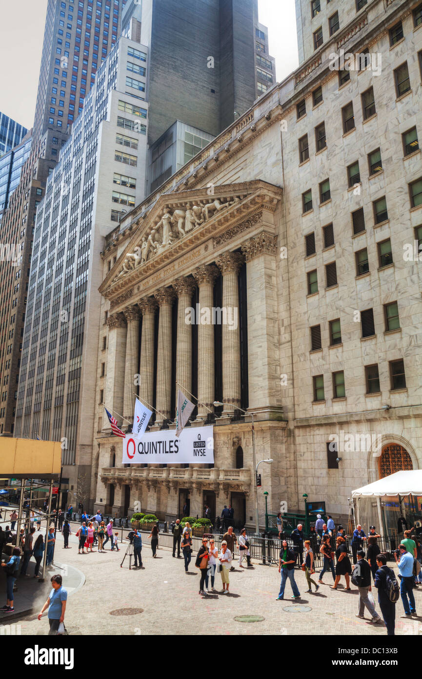 New York Stock Exchange building with tourists on May 10, 2013 in New York. The NYSE trading floor is located at 11 Wall Street Stock Photo