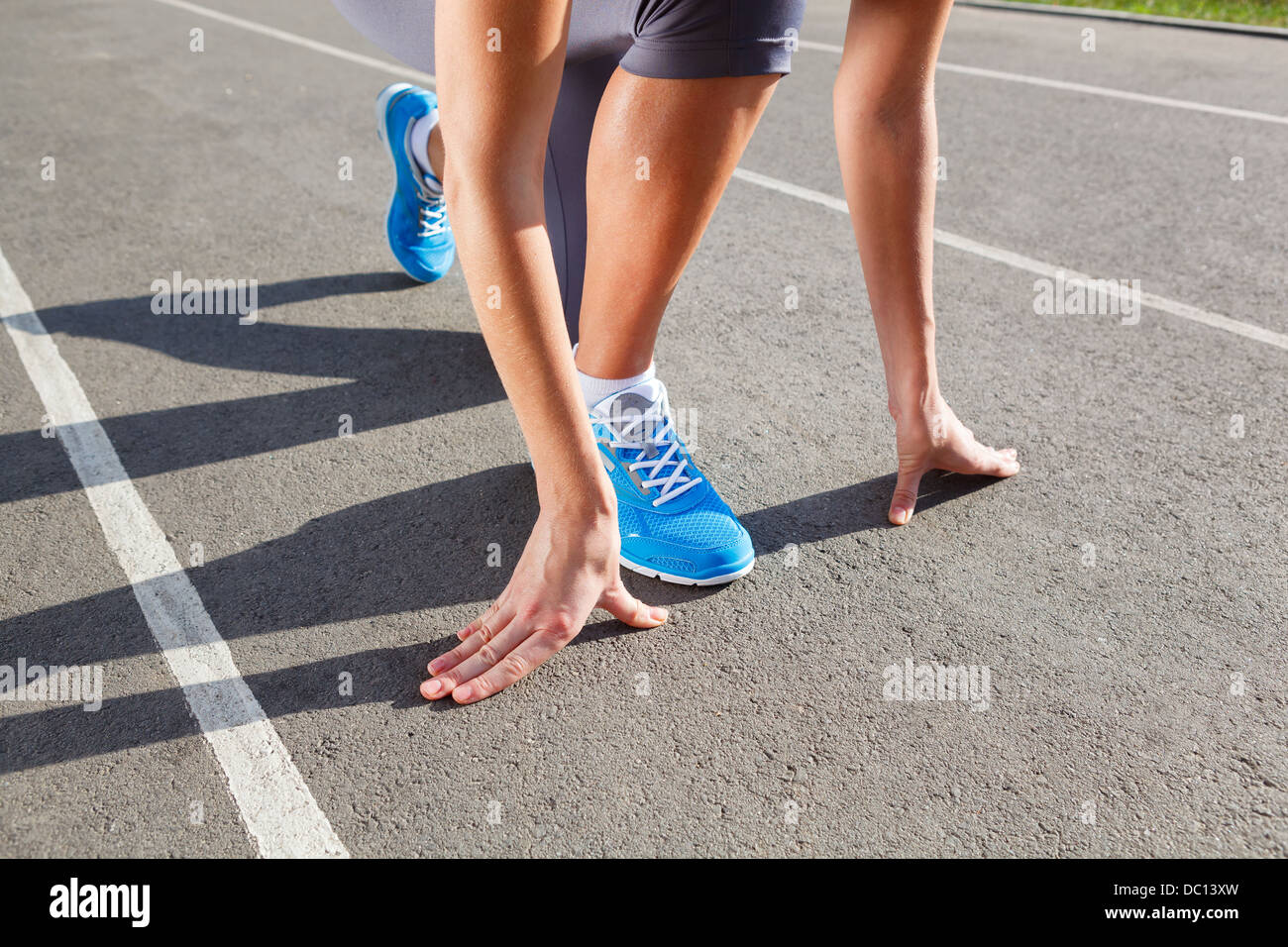 Runner Feet Running on Stadium Closeup -outdoor shot Stock Photo