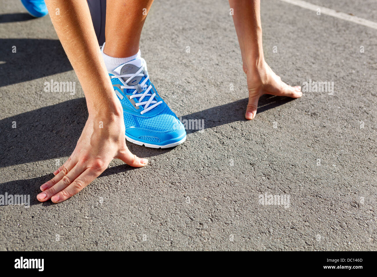 Runner Feet Running on Stadium Closeup -outdoor shot Stock Photo