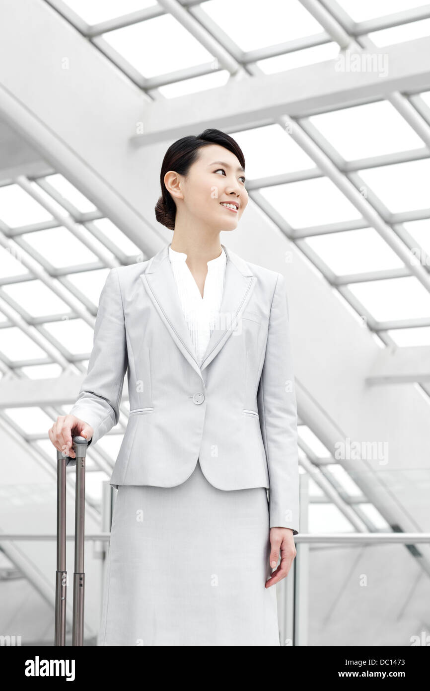 Woman standing in airport concourse hi-res stock photography and images ...