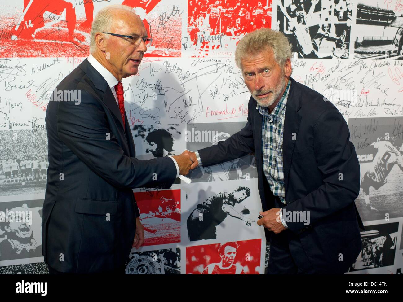 Berlin, Germany. 06th Aug, 2013. Franz Beckenbauer (L) and Paul Breitner sign on a signing board prior to an event to celebrate the 50th anniversary of the German Bundesliga in Berlin, Germany, 06 August 2013. Photo: Tim Brakemeier/dpa/Alamy Live News Stock Photo