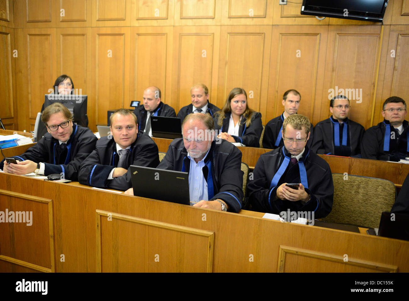 Prague, Czech Republic. 7th Aug, 2013.  From left: Roman Jelinek, Adam Cerny and Tomas Sokol, lawyers of suspects, wait at the Prague Regional Court, Prague, Czech Republic, August 7, 2013. David Rath, former Social Democrat (CSSD) regional governor and MP member, and ten other people are charged with corruption and manipulation of public tenders. Rath has been in custody since May 2012 when the police caught him with seven million crowns. Rath faces up to 12 years in prison. Credit:  Roman Vondrous/CTK Photo/Alamy Live News Stock Photo