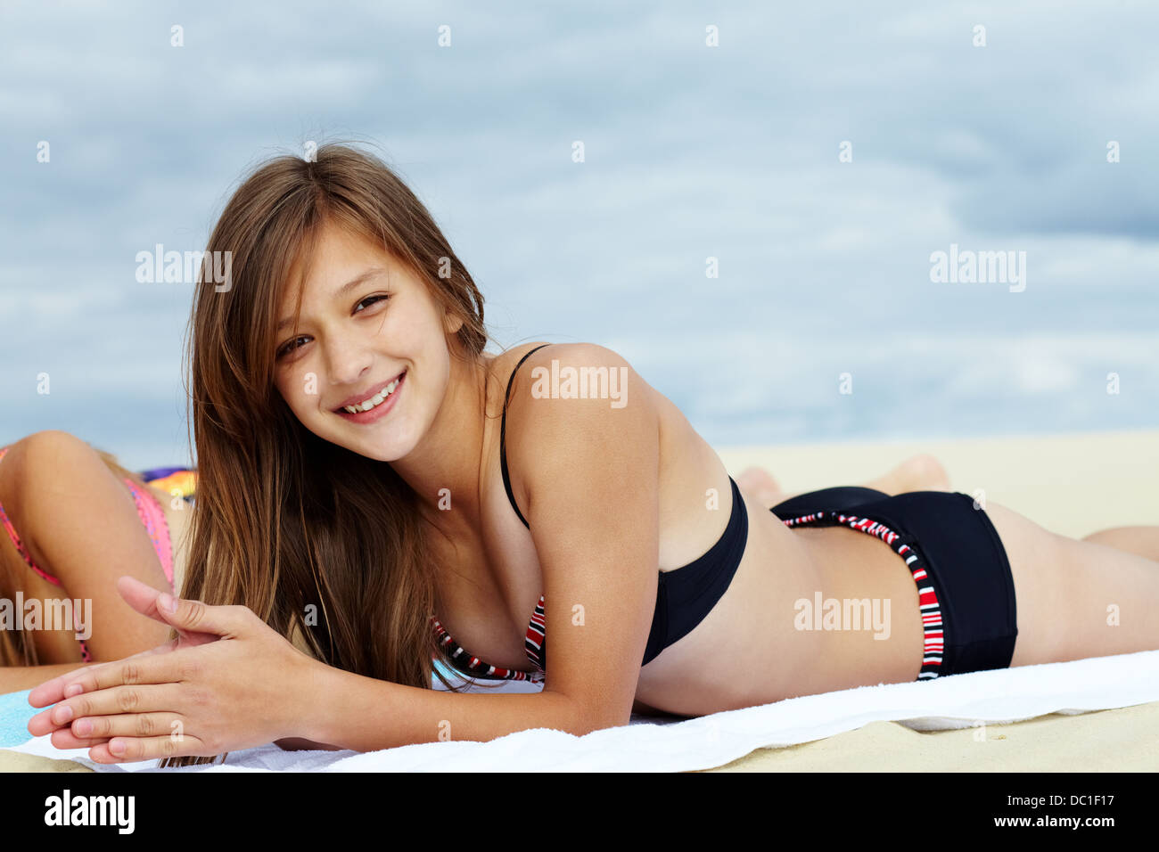 Portrait of teenage girl in bikini sunbathing and looking at camera Stock  Photo - Alamy