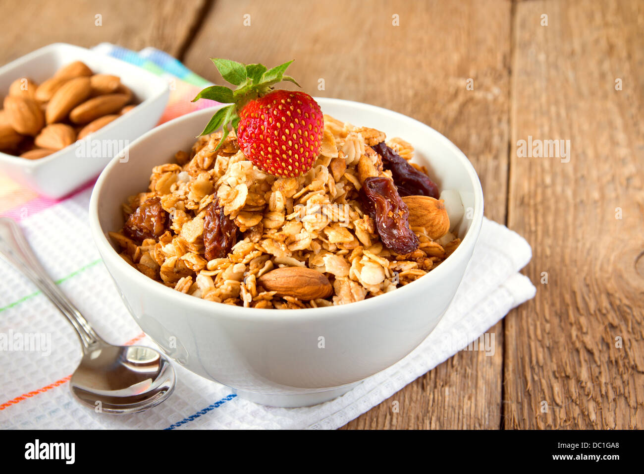 Musli (granola) close up with strawberry, dry fruits, nuts and cereals
