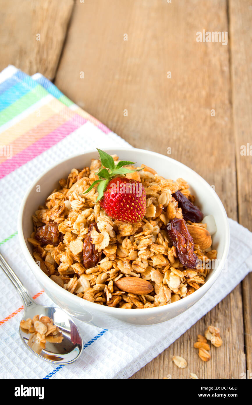 Musli (granola) close up with strawberry, dry fruits, nuts and cereals