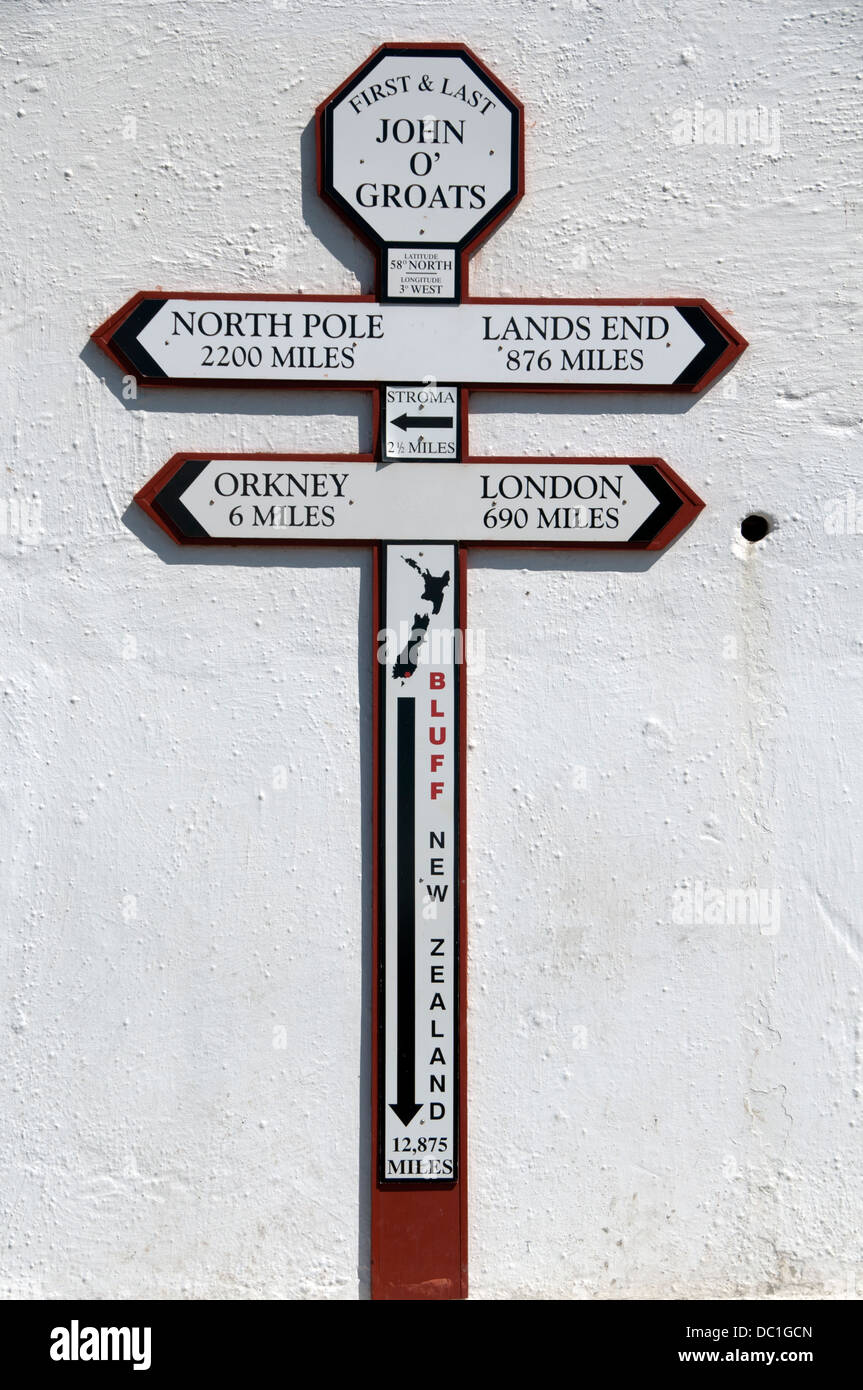 Distance sign on the wall harbour at John o'Groats, Cathness, Scotland, UK Stock Photo