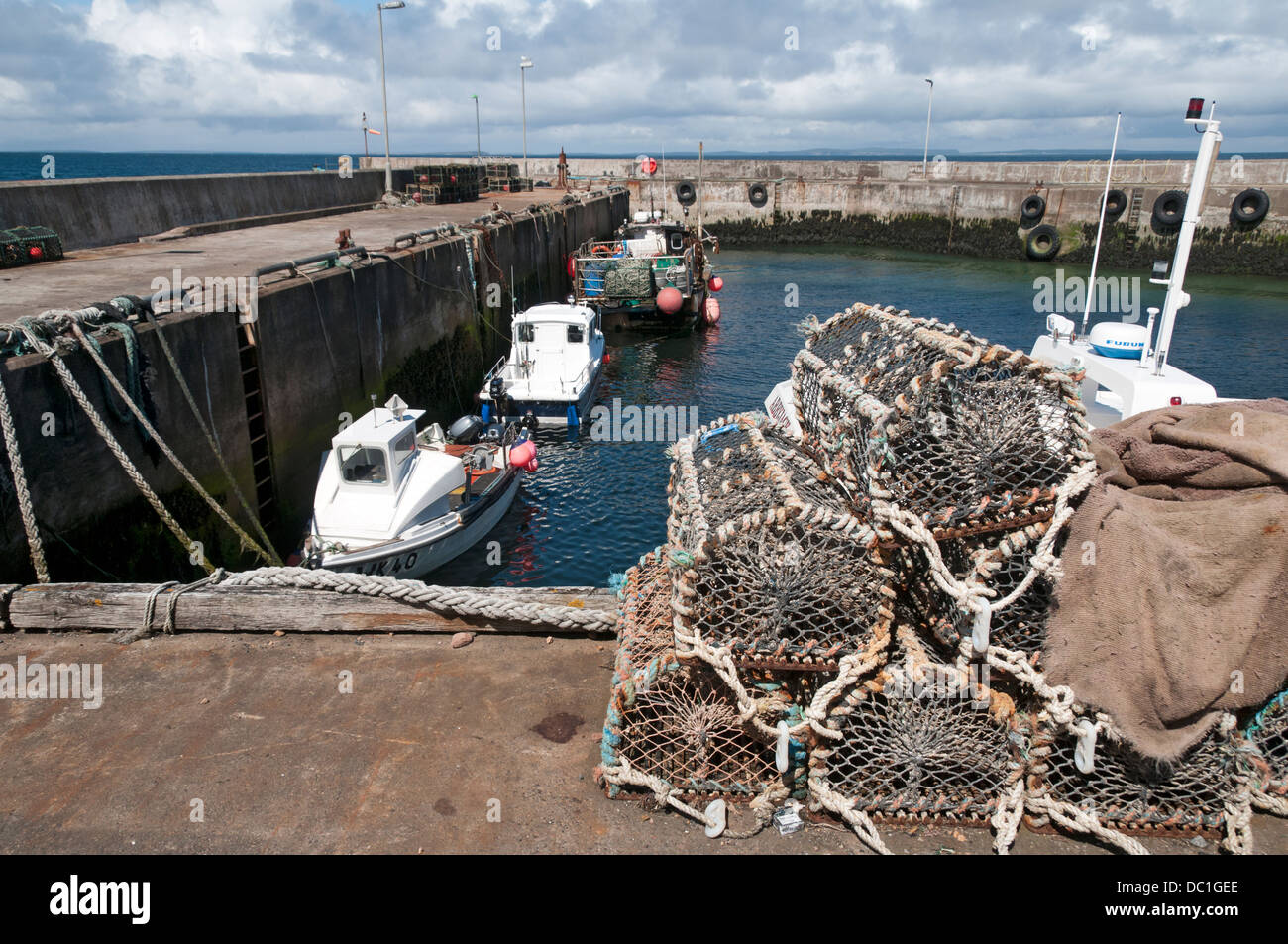 Lobster creels stacked by the harbour at John o'Groats, Caithness, Scotland, UK Stock Photo