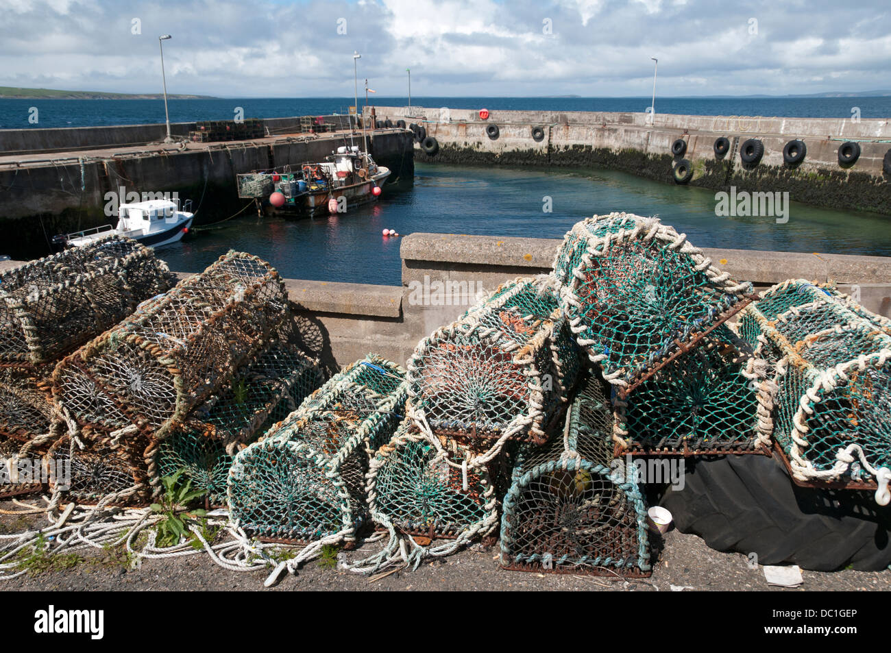 Lobster creels stacked by the harbour at John o'Groats, Caithness, Scotland, UK Stock Photo