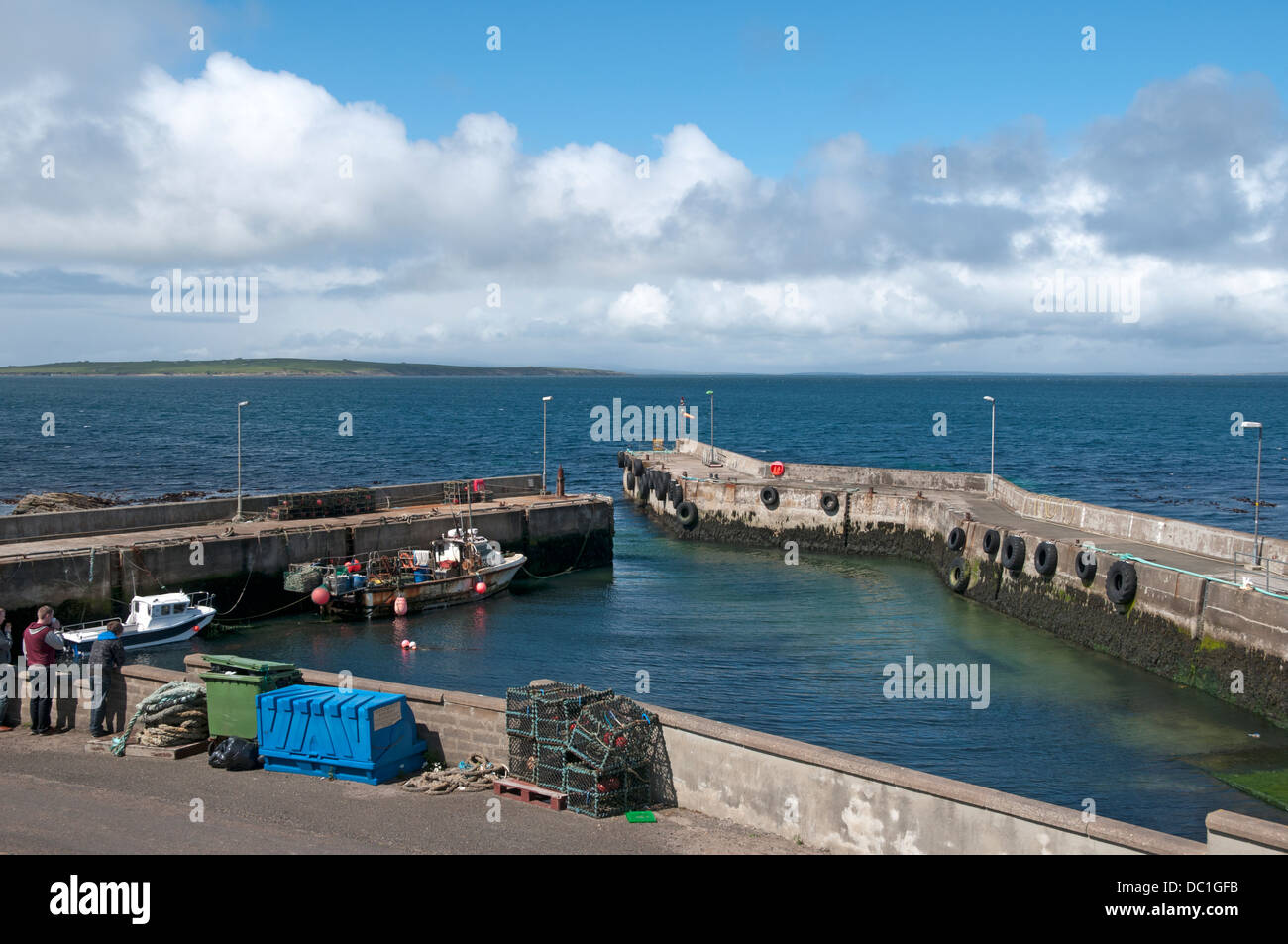 The harbour at John o'Groats, Caithness, Scotland, UK.  The island of Stroma in the distance. Stock Photo