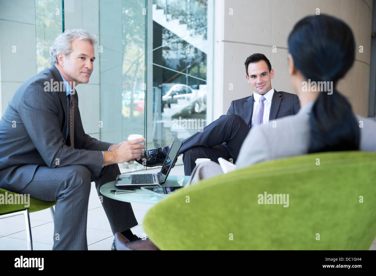 Business people meeting in lobby Stock Photo