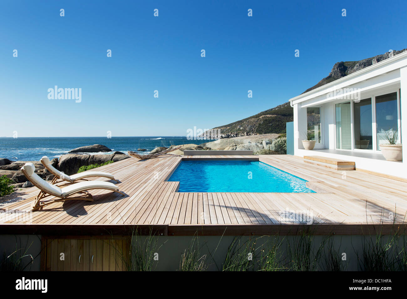 Luxury swimming pool with ocean view Stock Photo