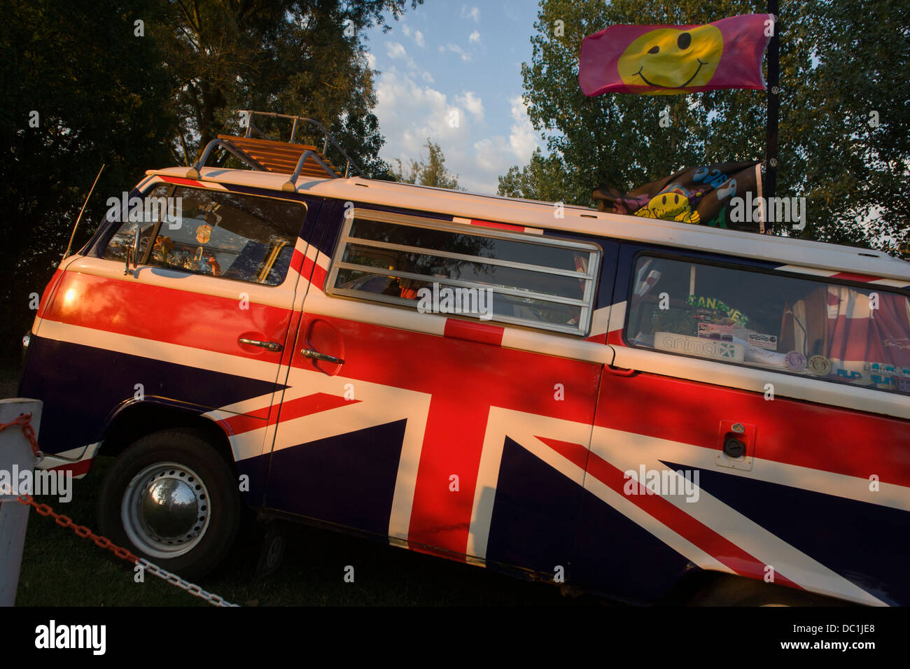 A VW camper van adorned with British Union Jacks colours, on a campsite at Reedham on the
