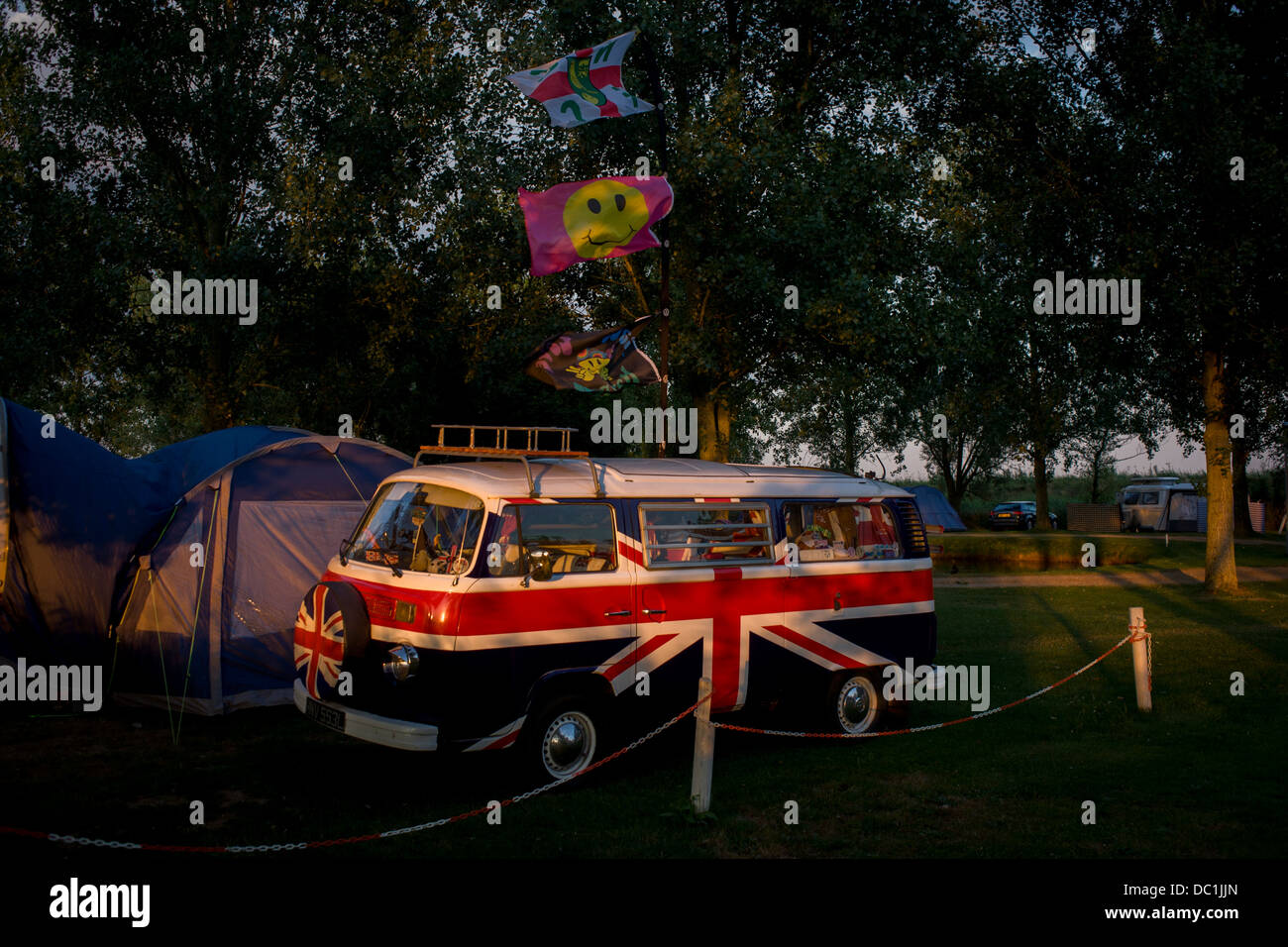A VW camper van adorned with British Union Jacks colours, on a campsite at Reedham on the