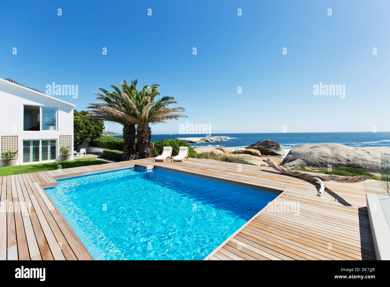 Luxury swimming pool with ocean view Stock Photo