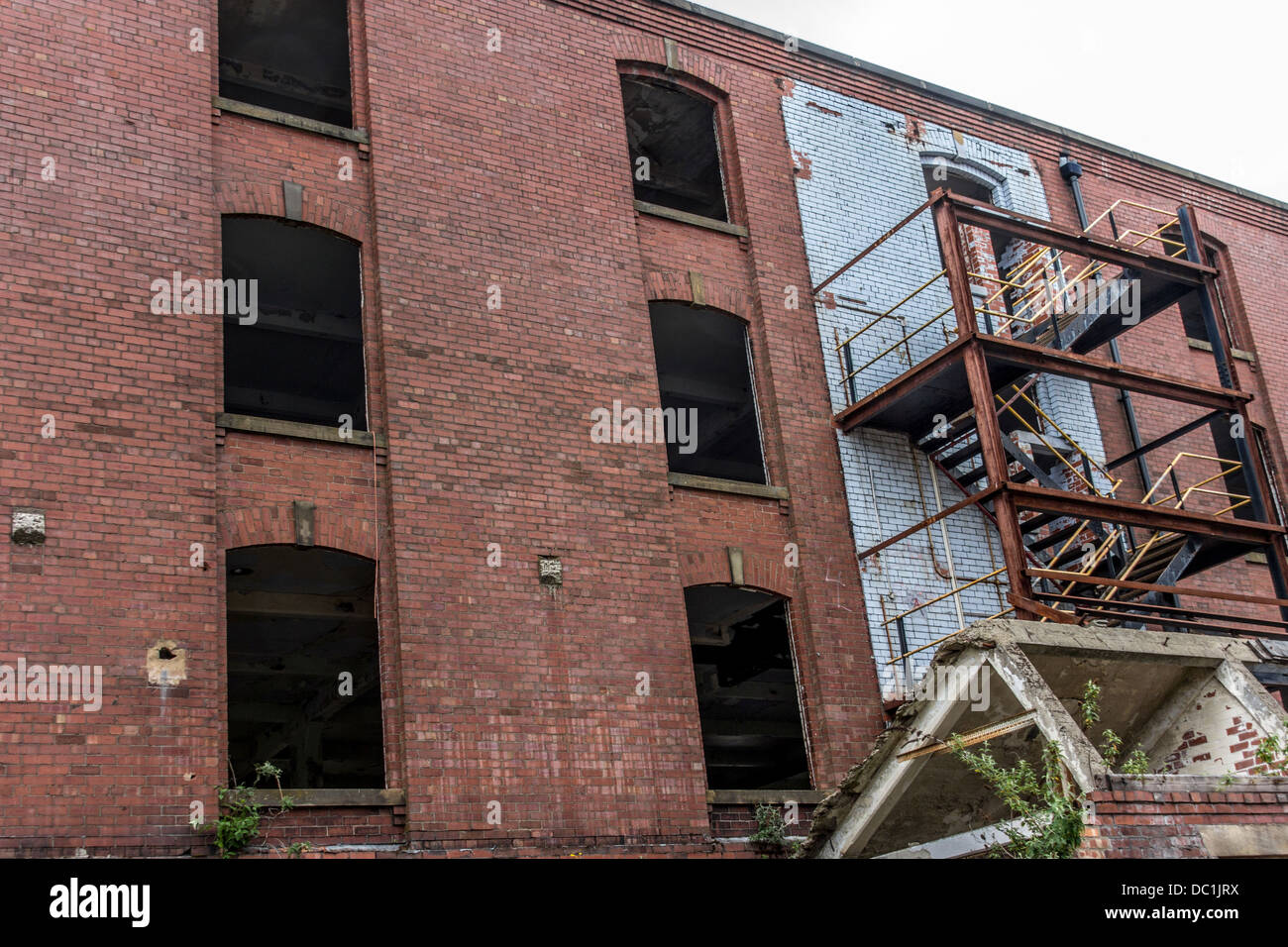 Old warehouse with fire escape missing windows Stock Photo Alamy