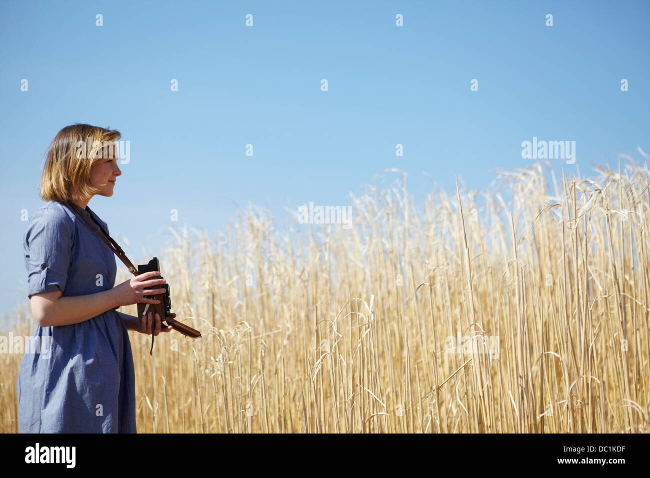 Young woman photographing reeds Stock Photo