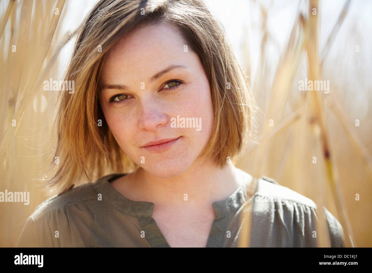 Close up portrait of young woman amongst reeds Stock Photo