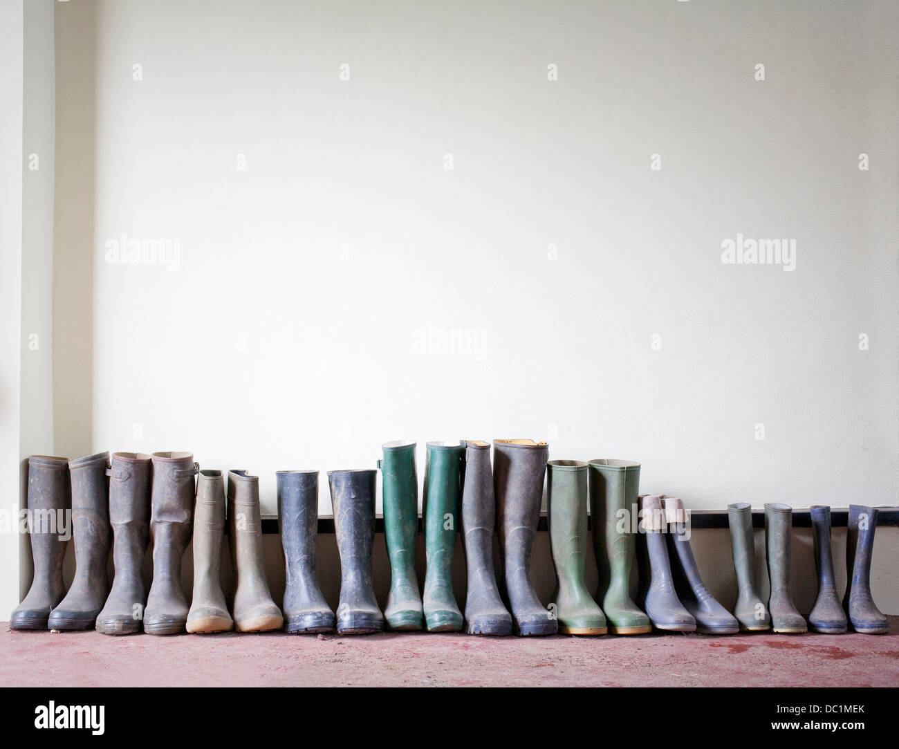 Rubber boots in a row Stock Photo