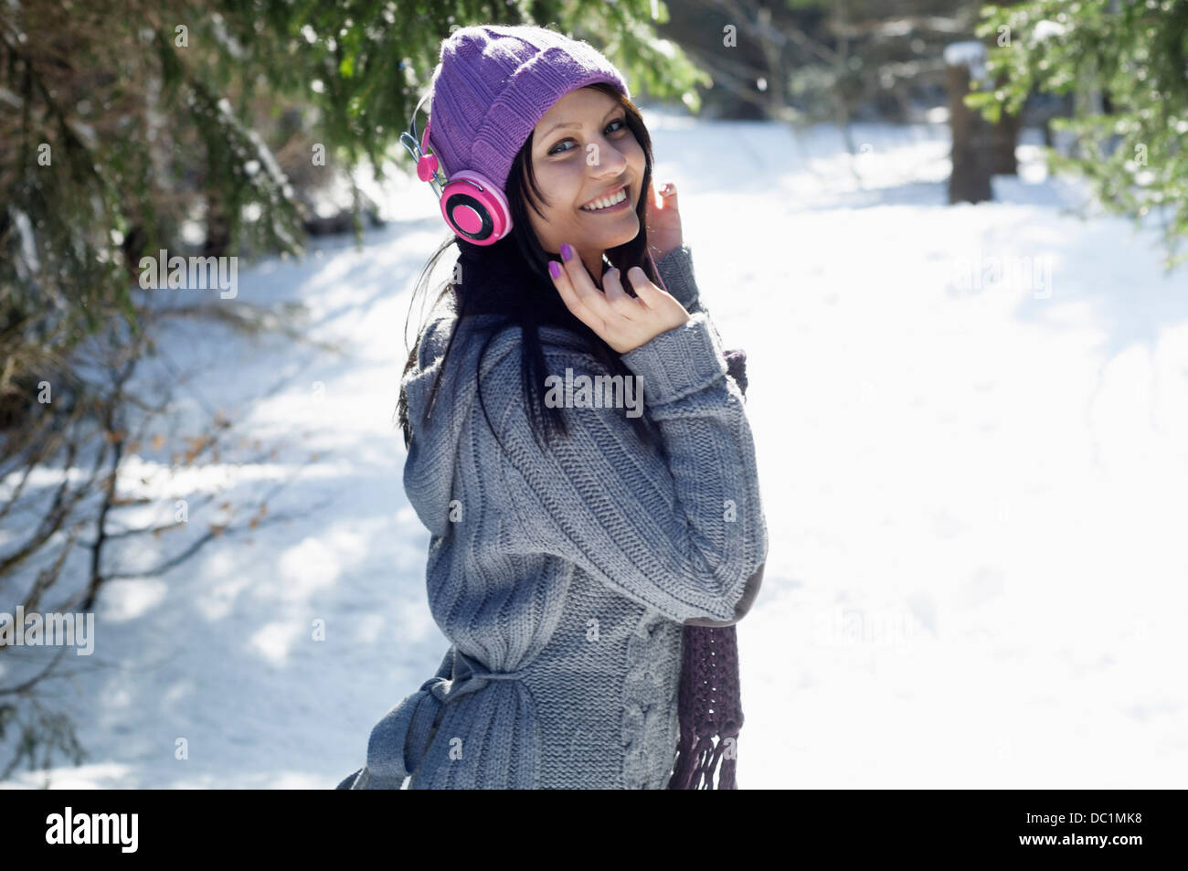 Portrait of young female listening to headphones Stock Photo