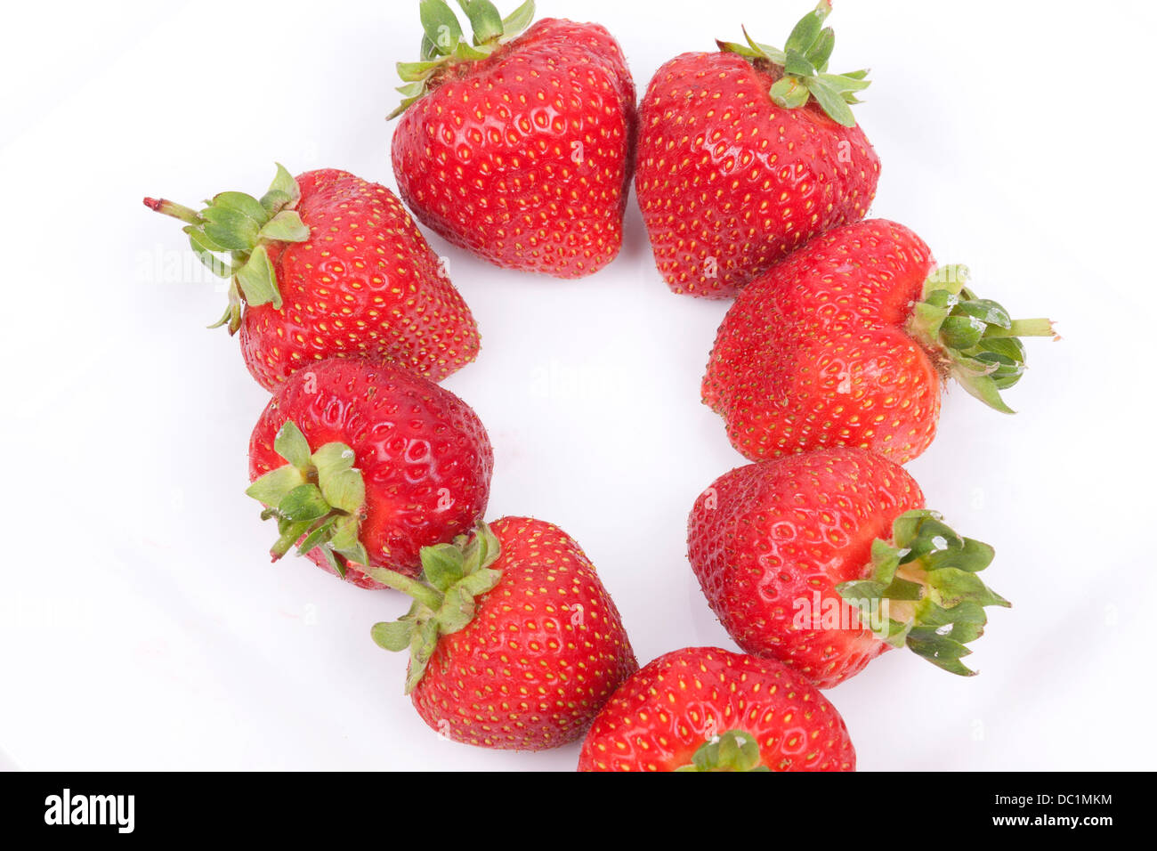 Strawberry fruits isolated on white background Stock Photo - Alamy