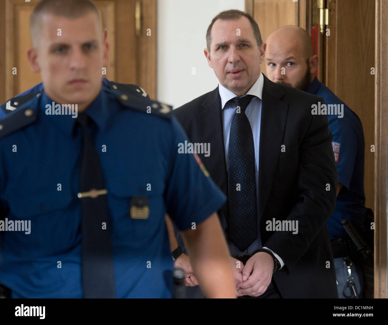 Prague, Czech Republic. 7th Aug, 2013. Former politician Petr Kott, center, leaves the Prague Regional Court, Prague, Czech Republic, August 7, 2013. David Rath, former Social Democrat (CSSD) regional governor and MP member, and ten other people are charged with corruption and manipulation of public tenders. Rath has been in custody since May 2012 when the police caught him with seven million crowns. Rath faces up to 12 years in prison. (CTK Photo/Michal Kamaryt/Alamy Live News Stock Photo