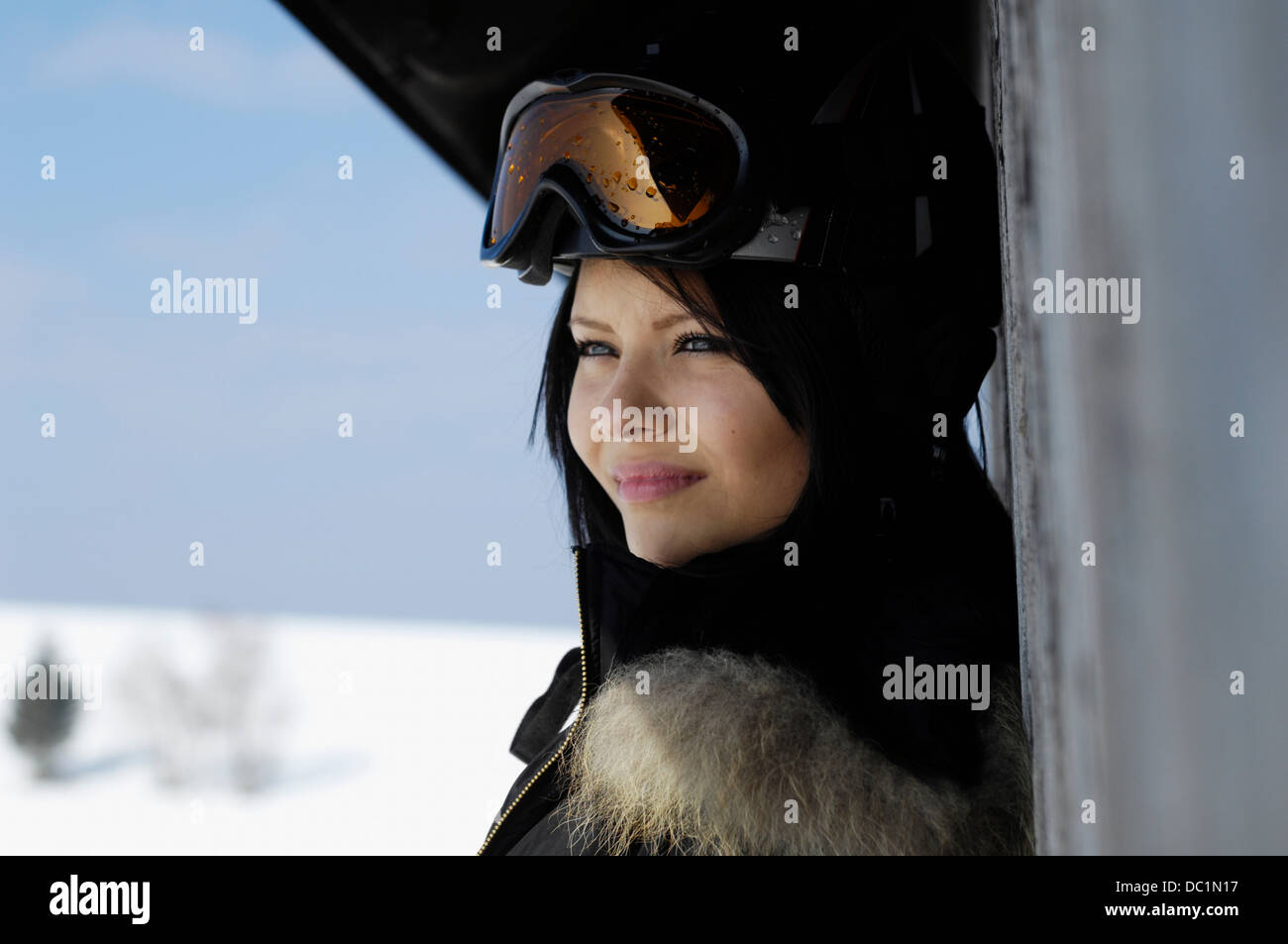 Close up portrait of young female wearing ski goggles Stock Photo