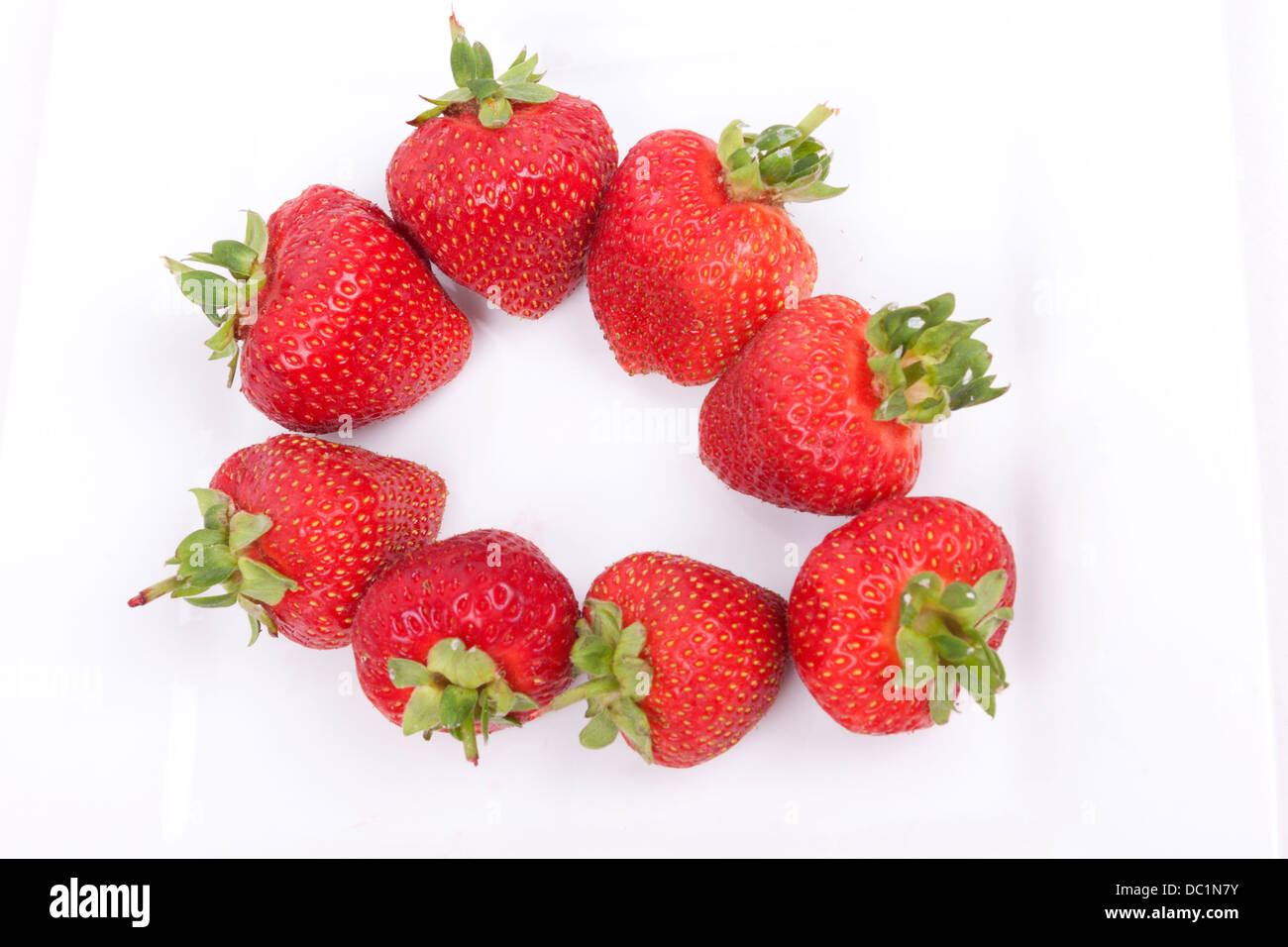Strawberry fruits isolated on white background Stock Photo - Alamy