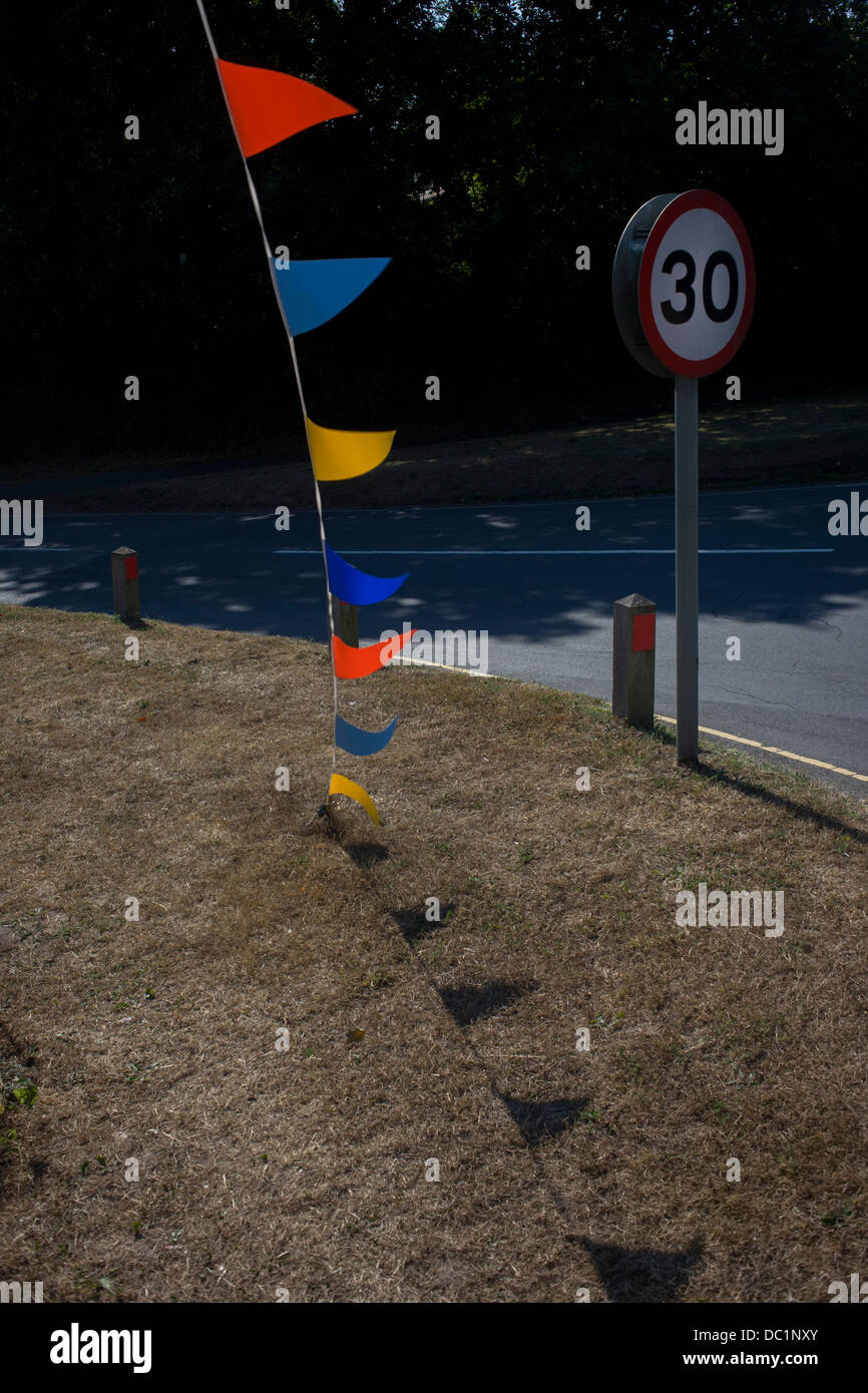 pennents and 30mph speed limit sign in summer shunshine at