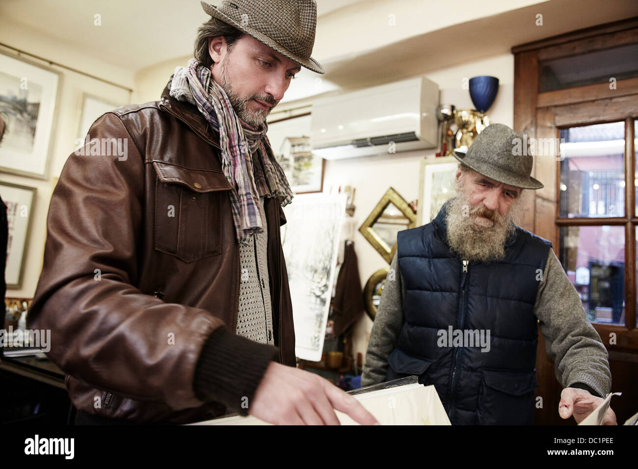 Senior and mid adult man in antique shop Stock Photo