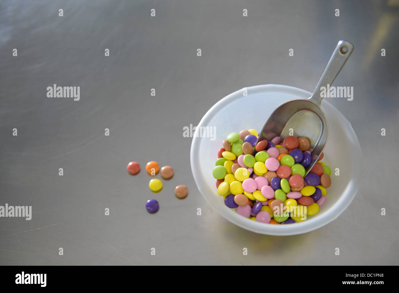 Still life bowl of multi colored sweets Stock Photo